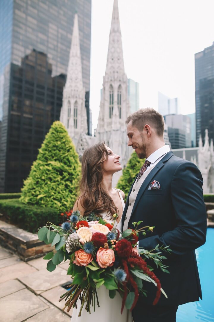 A man and woman standing next to each other.