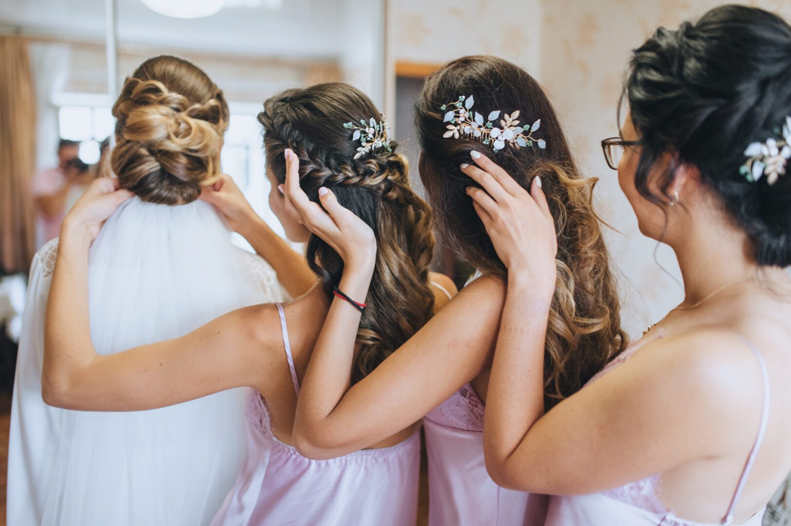A bride surrounded by bridesmaids