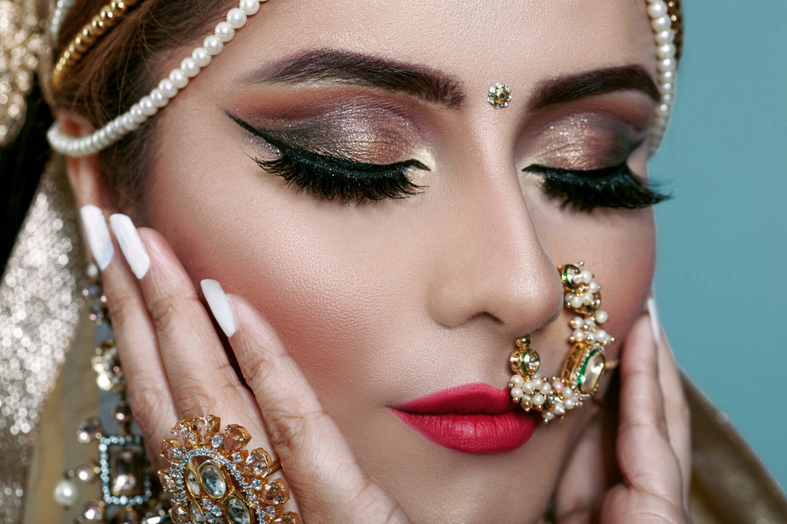 A person with glamorous makeup for an Indian wedding