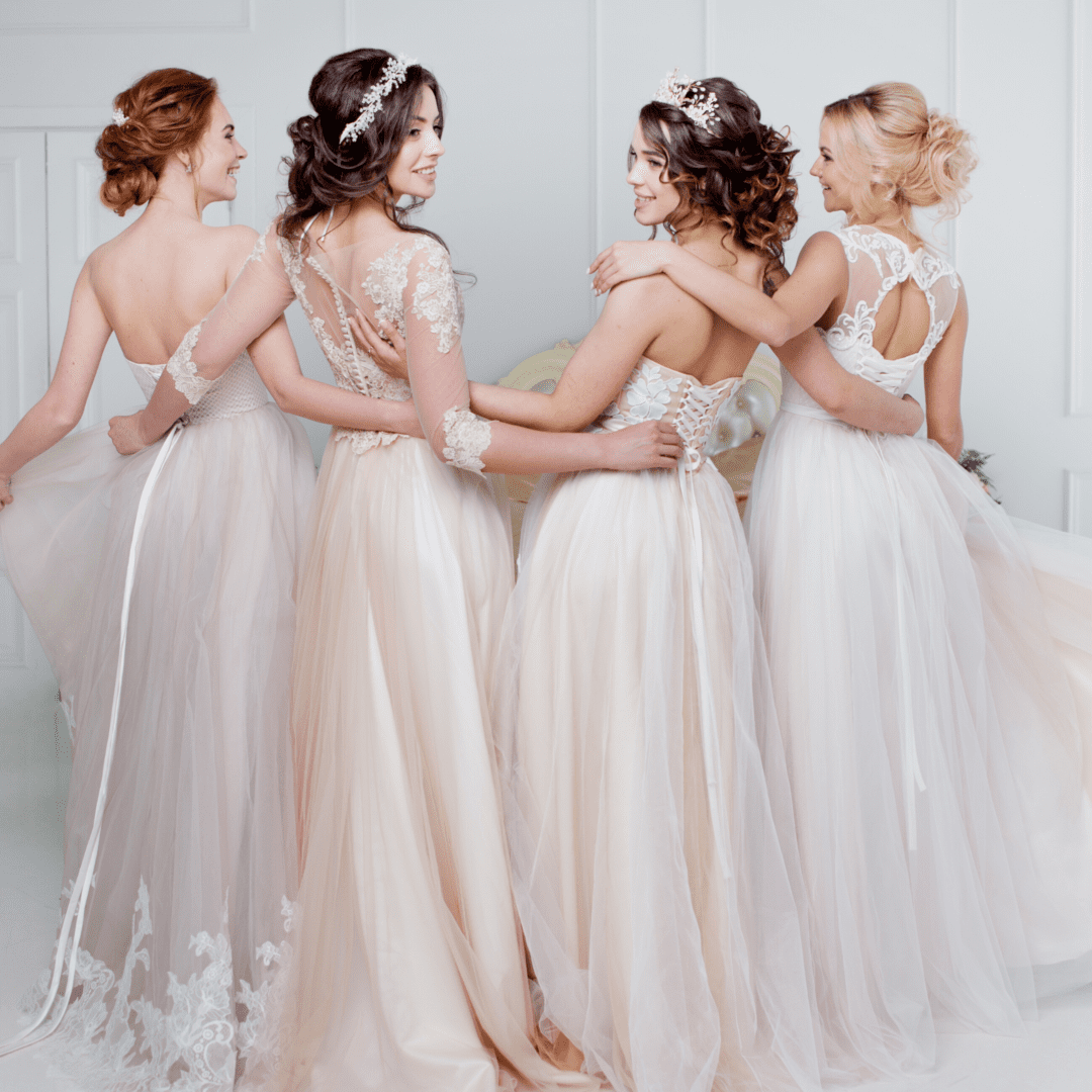 Four models wearing bridal gowns